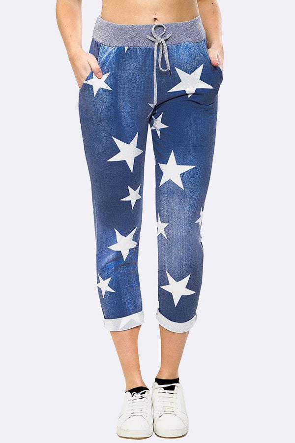 Womens star print foldover hem trousers in black